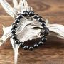 Créé à partir de belles perles de Bois de Santal noir au poli soyeux et aux reflets sensuels, ce bracelet dégage une grande quantité d’ Énergie positive.